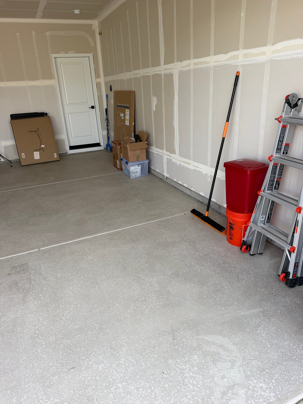 Interior space with boxes, storage containers and items being cleared