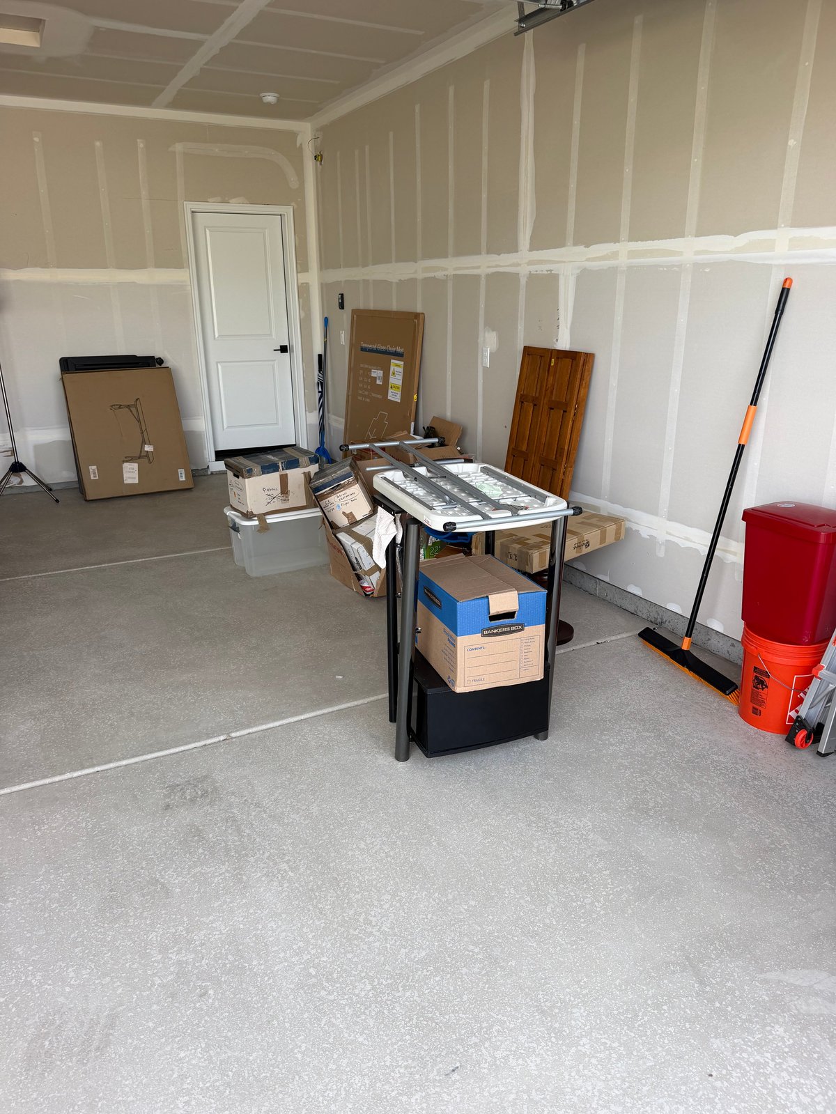 Cluttered interior space with boxes and stored belongings